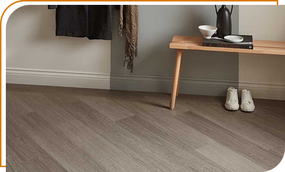 Minimalist entryway with wooden bench and sneakers on gray hardwood floors